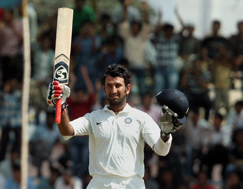 India A captain Cheteshwar Pujara celebrates his triple hundred against West Indies A during the 3rd day of their 3rd unofficial test match in Hubli on Friday. PTI Photo