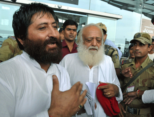 Asaram Bapu (RIGHT)  and his son Narayan Sai (LEFT). PTI File Photo