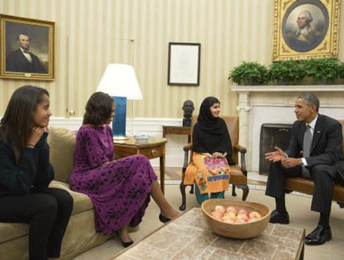 U.S. President Obama, First Lady Michelle Obama and their daughter Malia meet with Pakistani teenage activist Malala Yousafzai at the White House. REUTERS