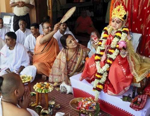 A priest offering 'Kumari puja' to a minor girl on the Maha Ashtami at a Ramakrishna Mission Durga Puja Mandap in Guwahati on Saturday. PTI Photo