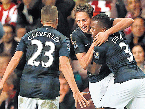 Adnan Januzaj (centre) announced his arrival on the big stage with two spectacular goals  for Manchester United. Reuters