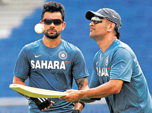 Skipper MS Dhoni (right) and Virat Kohli need to play vital roles for India against Australia on Sunday. AP