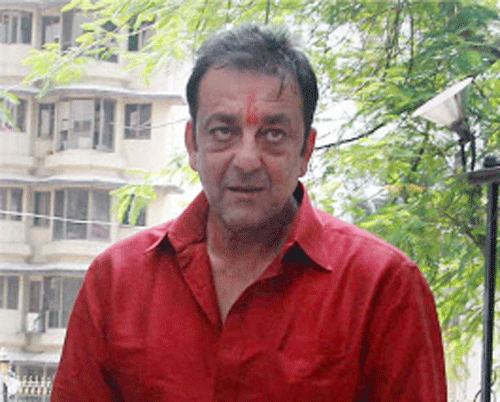 Bollywood actor Sanjay Dutt arrives at his residence in Mumbai on Tuesday after he was granted a two-week parole by Pune's Yerawada Central Jail authorities for medical reasons. PTI Photo