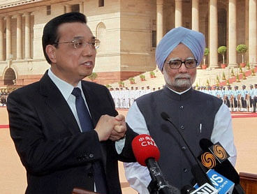 File Photo of Chinese Premier Li Keqiang talking to the media as Prime Minister Manmohan Singh looks at Rashtrapati Bhavan. PTI