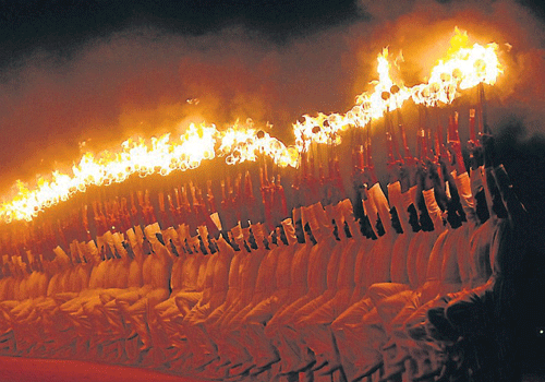Playing with fire: Personnel from Yelahanka Police Training Institute perform at Torchlight Parade Grounds, marking the end of Mysore Dasara celebrations, in Mysore, on Monday.
