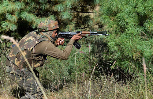 An Army soldier taking position during an encounter with militants in Keran sector of J & K on Saturday. The Army foiled yet another infiltration bid in Fateh Gali region of Keran sector in Kashmir. PTI Photo