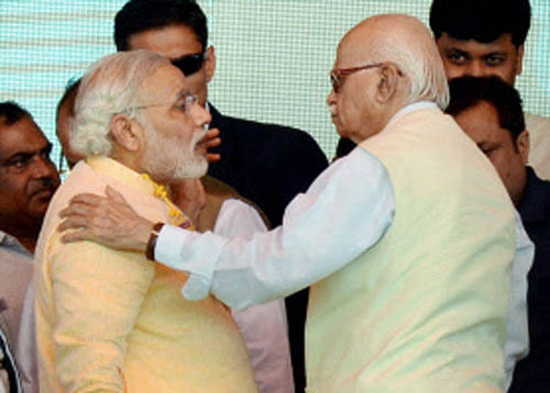 BJP Prime Ministerial candidate Narendra Modi and senior leader LK Advani. PTI file image