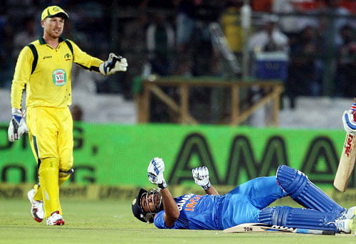India's Rohit Sharma falls on the ground during 2nd ODI against Australia in Jaipur on Wednesday. PTI Photo