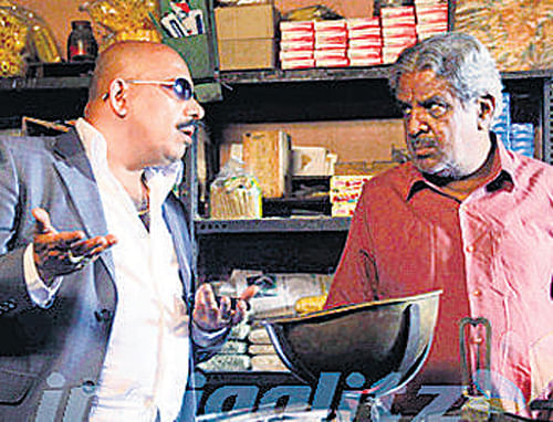 Manohar and Dattatreya in the movie Bharat Stores.