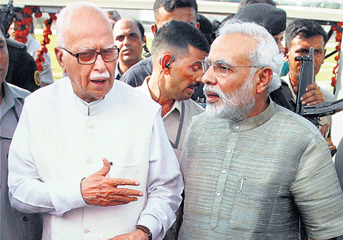 Senior BJP leader L K Advani with Gujarat Chief Minister and the party's prime ministerial candidate Narendra Modi at the inauguration of River Park in Ahmedabad on Wednesday. PTI