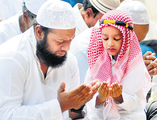 Engrossed in prayers: Muslims offer Bakrid prayers at the Idgah maidan on Miller's Road on Wednesday. dh photo