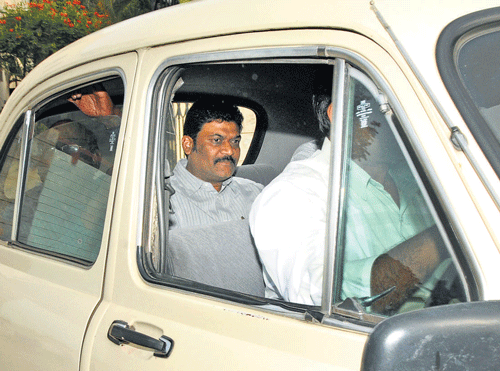 Hospet MLA Anand Singh being taken to the court in Bangalore on Thursday.