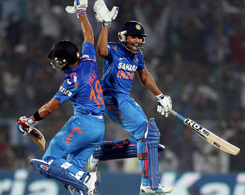 India's Rohit Sharma and Virat Kohli celebrate team's victory over Australia in the 2nd ODI in Jaipur on Wednesday. PTI Photo