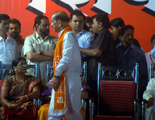Shiv Sena leader Manohar Joshi leaves from the Sena's 48th Dassera rally after sena activists shouted against him at Shivaji Park in Mumbai on Sunday. PTI Photo