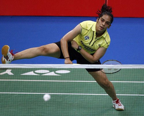 Defending champion Saina Nehwal of India crashed out of the Denmark Super Series Premier after suffering a shock three-game defeat at the hands of Korea's Sung Ji Hyun. PTI file photo