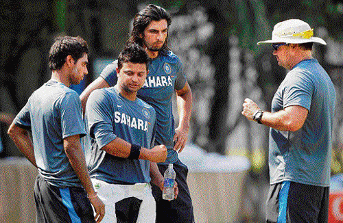 Let's try this way: Indian team members during a net session at the Punjab Cricket Association stadium on Friday. pti