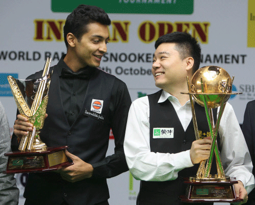 Chinese Snooker player Ding Junhui and Indian Snooker player Aditya Mehta pose with their trophies after the final match of the World Ranking Snooker Indian open 2013, in New Delhi on Friday. PTI