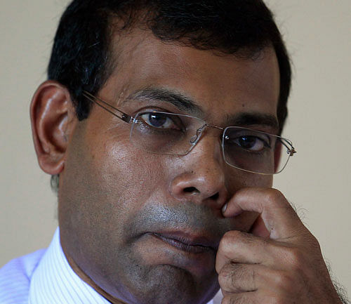 Maldivian presidential candidate Mohamed Nasheed, who was ousted as president in 2012, listens to a question from a journalist during a news conference in Male. Reuters