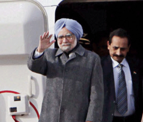 Prime Minister Manmohan Singh waves upon his arrival at the Government Airport Vnukovo-2 outside Moscow, Russia on Sunday. PTI Photo