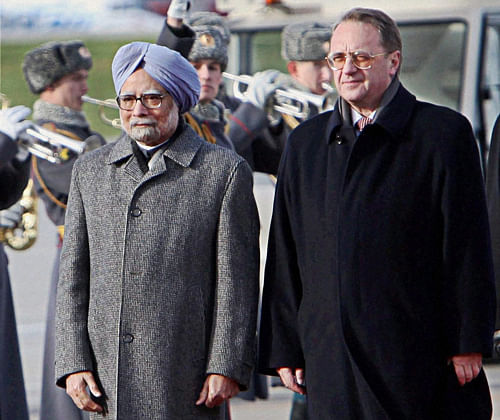 Prime Minister Manmohan Singh with Russian Deputy Foreign Minister Mikhail Bogdanov reviews the honor guard, upon his arrival at the Government Airport Vnukovo-2 outside Moscow, Russia on Sunday. PTI Photo