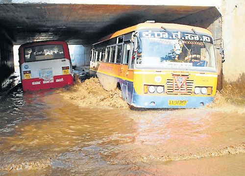 Following heavy rainfall, a railway under-bridge in Nanjangud, Mysore district, was inundated, on Sunday. DH PHOTO