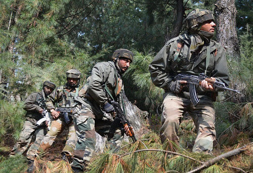 Army jawans patrol near Line of Control (LOC) in Poonch. PTI Photo