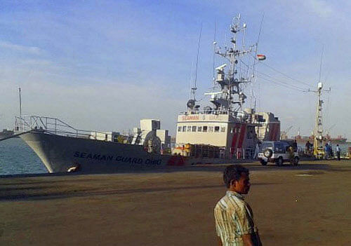 This Sunday, Oct. 13, 2013 image made from video shows U.S.-owned ship MV Seaman Ohio detained at the Tuticorin port in Tamil Nadu, India. Indian police said they are questioning the crew of the ship accused of illegally transporting weapons and ammunition in Indian waters. Indian marine security police in Tuticorin filed a complaint Monday, Oct. 14, 2013 against crew and security guards aboard the MV Seaman Ohio after they failed to produce documents allowing them to carry the weapons. An Indian Coast guard official said the ship is owned by Virginia-based AdvanFort but is registered in Sierra Leone. AP