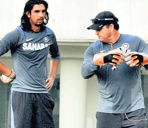 getting it right: Paceman Ishant Sharma chats with bowling coach Joe Dawes during India's practice session at the JSCA stadium in Ranchi on Monday. PTI