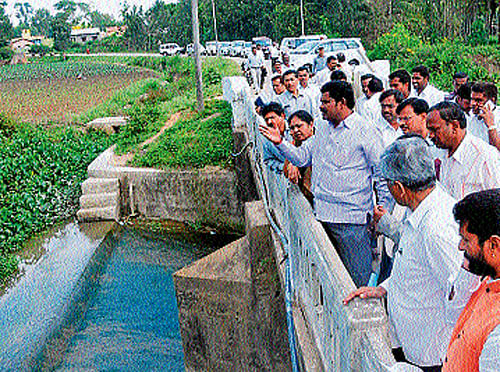 Quenching thirst: Minister for Minor Irrigation Shivaraj S Thangadagi inspects the pick-up canal for Karagada drinking water project near Chikmagalur on Monday.  DH Photo