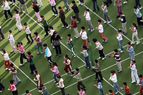Chinese schoolchildren perform morning exercises at their school in Shanghai. File photo - Reuters