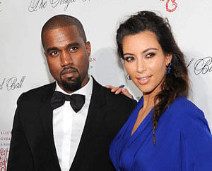 Rapper Kanye West along with his longtime girlfriend Kim Kardashian. File photo