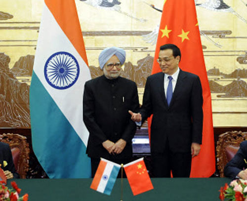 Li Keqiang and Manmohan Singh attend a signing ceremony at the Great Hall of the People in Beijing Reuters Image