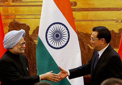 Prime Minister Manmohan Singh with Chinese Premier Li Keqiang after a joint statement at the Great Hall of the People in Beijing, China on Wednesday. PTI Photo