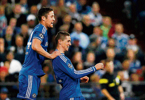 blue thunder: Fernando Torres (right) celebrates with Gary Cahill after scoring against Schalke 04 on Tuesday. AFP