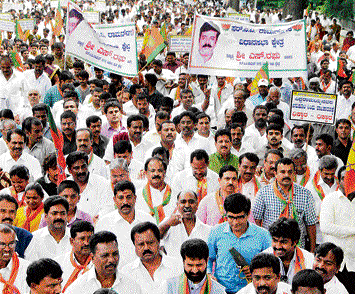 growing clamour: BJP leaders take out a protest rally from Freedom Park demanding the resignation of minister Santosh Lad on Wednesday. dh photo