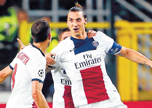 super strike: Paris St Germain's Zlatan Ibrahimovic celebrates after scoring against Anderlecht on Wednesday. reuters