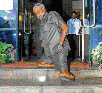 Spot inspection: Disabilities Commissioner K S Rajanna comes out of Karnataka Pollution Control Board office in Bangalore after an inspection on Thursday. dh photo