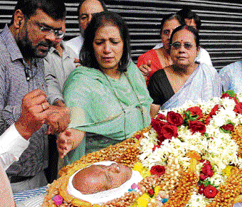 FInal journey: Shumita Deb pays her last respects to her father, legendary singer Manna Dey, at Ravindra Kalakeshtra on Thursday. DH Photo
