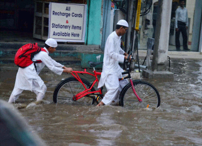 Local streets were flooded after heavy rains in Hyderabad on Monday evening. PTI