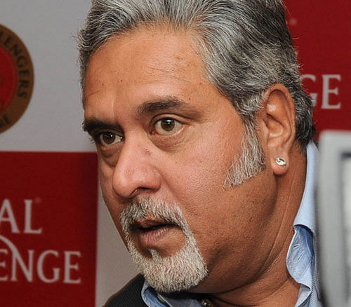 Hit by financial woes, Kingfisher Airlines, owned by Vijay Mallya (in pic), has been grounded for the past one year. DH File Photo