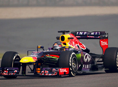 Red Bull Formula One driver Sebastian Vettel of Germany drives during the first practice session of the Indian F1 Grand Prix at the Buddh International Circuit in Greater Noida, on the outskirts of New Delhi, October 25, 2013. REUTERS