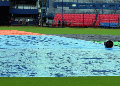 Pitch is covered due to incessant rain from last five days at Barabati Stadium in Cuttack on Friday where the 5th ODI between India and Australia that is to be held on Saturday in Cuttack. PTI Photo