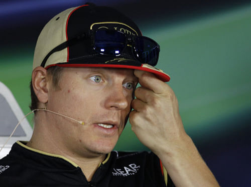 Lotus driver Kimi Raikkonen of Finland answers a question during the drivers press conference ahead of the Indian Formula One Grand Prix at the Buddh International Circuit in Noida, India, Thursday, Oct. 24, 2013.  AP Photo.