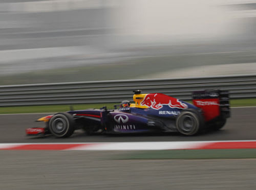Red Bull driver Sebastian Vettel of Germany steers his car during the second practice session at the Indian Formula One Grand Prix at the Buddh International Circuit in Noida, India, Friday, Oct. 25, 2013. AP Photo.