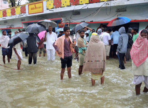 A view of a flooded locality after heavy rains in Hyderabad on Friday. PTI