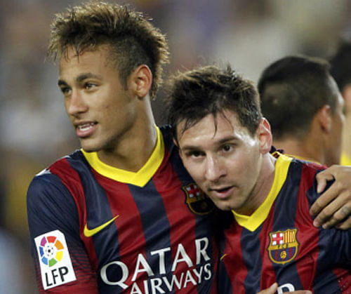 Barcelona's Neymar (L) and Lionel Messi celebrate victory over Real Madrid at the end of their Spanish first division 'Clasico' soccer match at Nou Camp stadium in Barcelona October 26, 2013. REUTERS