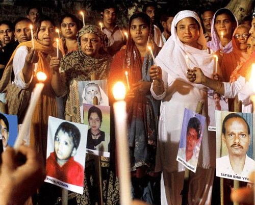 Survivors and relatives of the victims of the 2002 Gujarat riots light candles in Ahmedabad on the occasion of the10th anniversary of the riots.- File photo - PTI