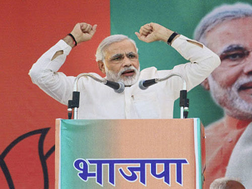 BJP Prime Ministerial candidate & Gujrat Chief Minister Narendra Modi addressing during a election rally. PTI Image