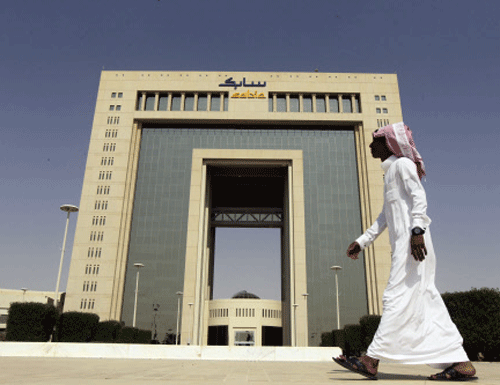 A man walks past  a building near Riyadh. A video apparently showing a Saudi national mercilessly beating an Asian man after accusing him of talking to his wife has triggered public anger, forcing Saudi Arabia's Human Rights Commission to probe the matter. Reuters
