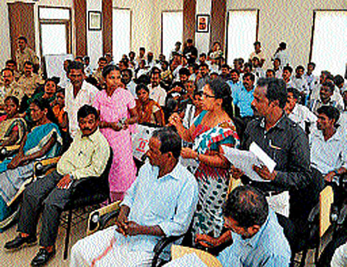 Members of Scheduled Caste and Scheduled Tribe indulge in an argument at the SC and ST monthly grievance meet at police commissioner's office in Mangalore on Sunday. dh photo